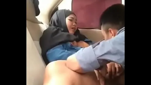 Tonton Hijab girl in car with boyfriend drive Video
